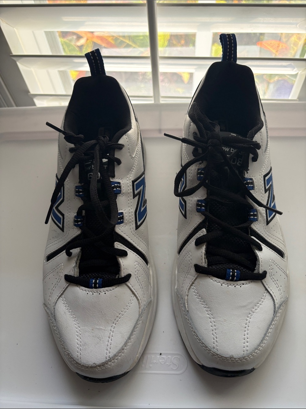 New Balance Men's White and Black Sneakers with Blue Logo Details 608